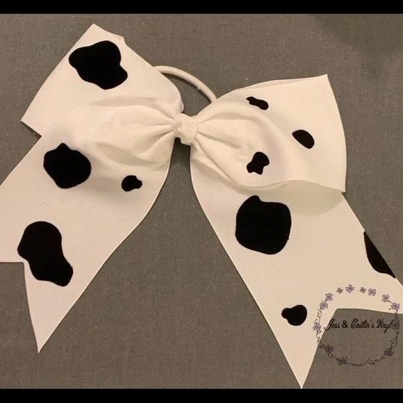 Handmade cowprint bows/hair ties. - Picture 1 of 1